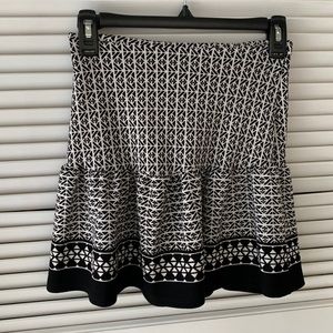 Sleeveless black and white top.